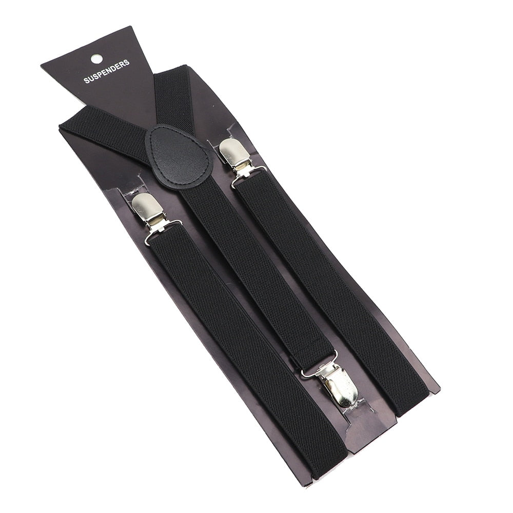 Leather Suspenders With Elastic Adjustable Straps. Comes in a variety of solid Colors.