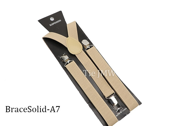 Leather Suspenders With Elastic Adjustable Straps. Comes in a variety of solid Colors.