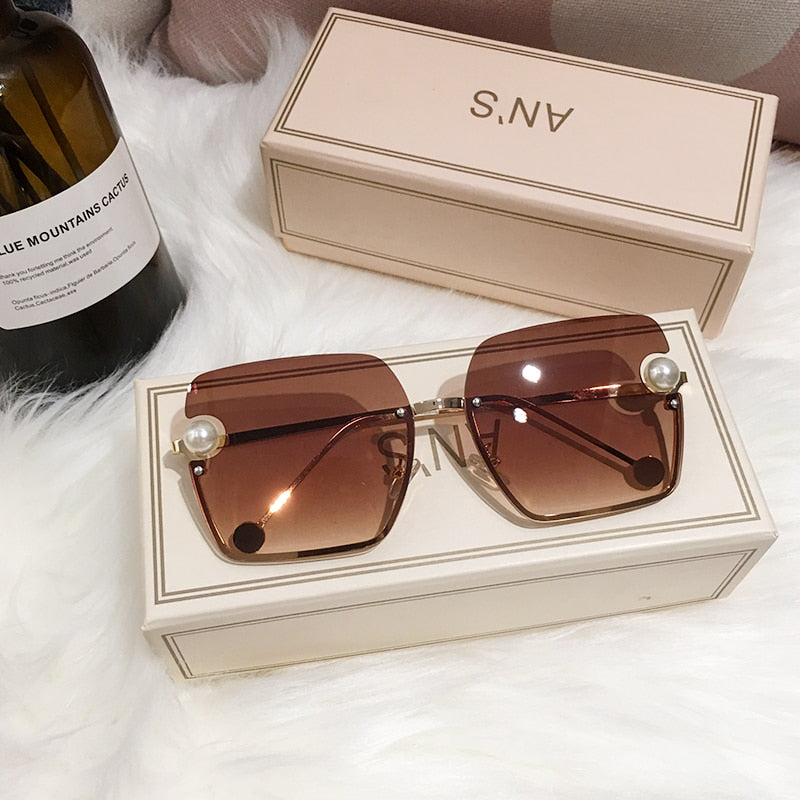 Ladies Rimless Sunglasses UV400 pearl.