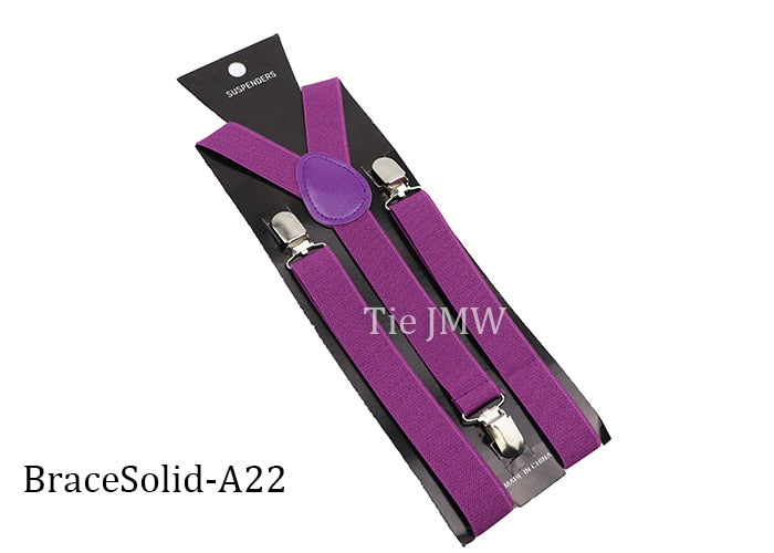 Leather Suspenders With Elastic Adjustable Straps. Comes in a variety of solid Colors.