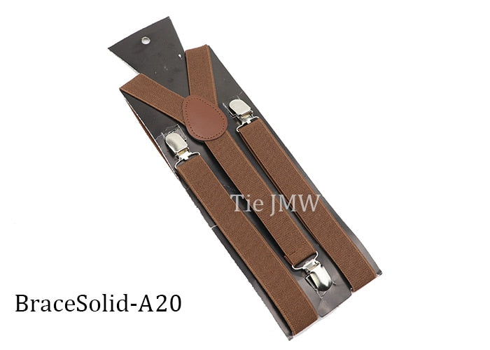 Leather Suspenders With Elastic Adjustable Straps. Comes in a variety of solid Colors.