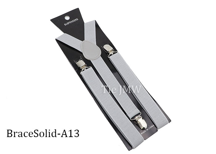 Leather Suspenders With Elastic Adjustable Straps. Comes in a variety of solid Colors.