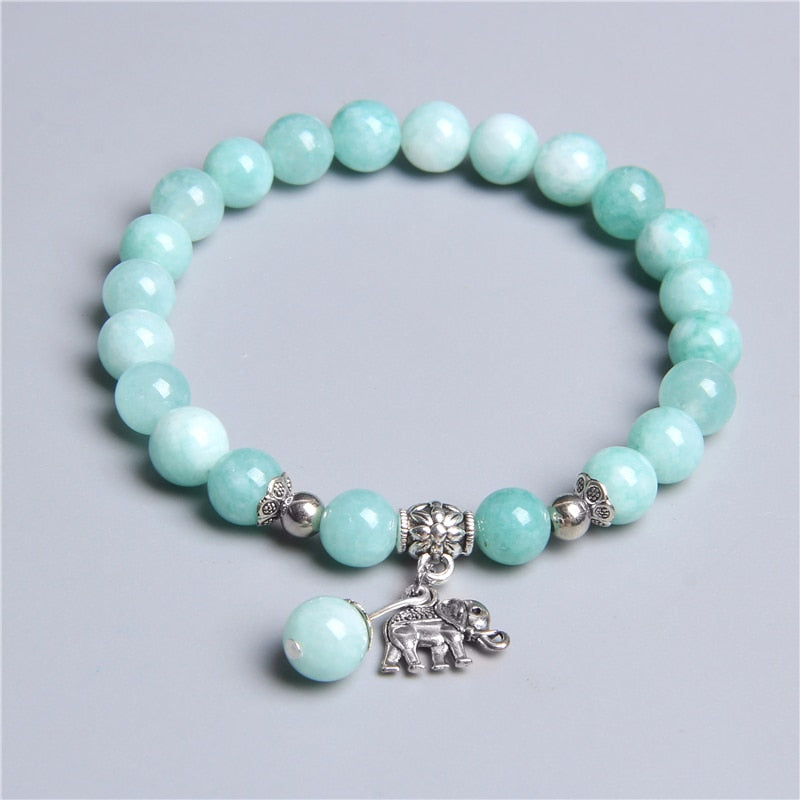 Ladies blue amazonite beaded bracelet with a metal elephant charm.