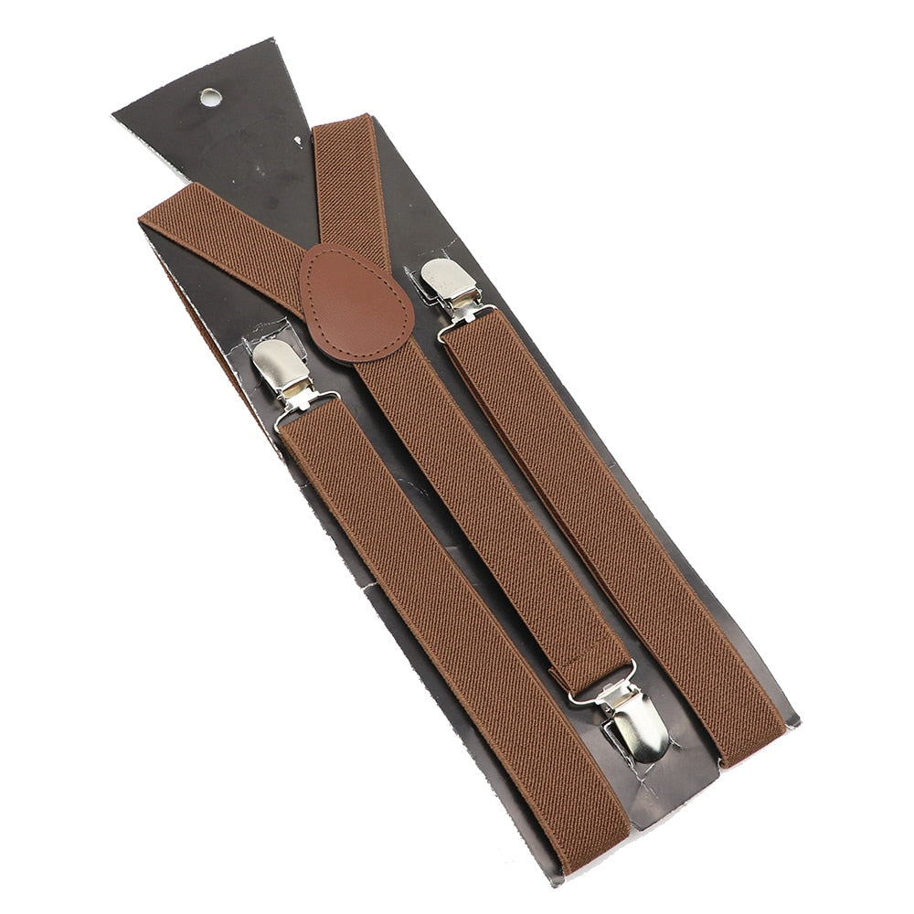 Leather Suspenders With Elastic Adjustable Straps. Comes in a variety of solid Colors.
