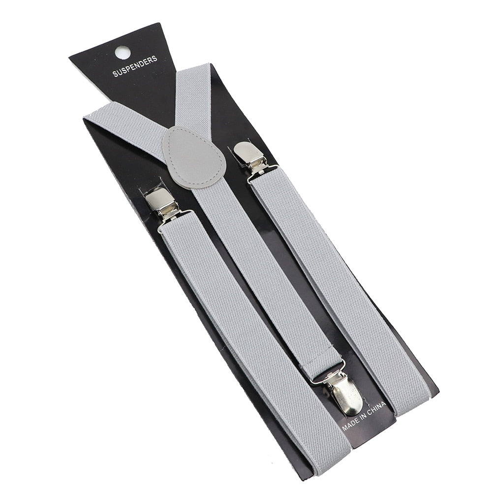 Leather Suspenders With Elastic Adjustable Straps. Comes in a variety of solid Colors.