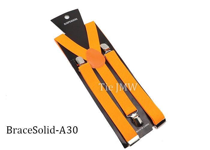 Leather Suspenders With Elastic Adjustable Straps. Comes in a variety of solid Colors.