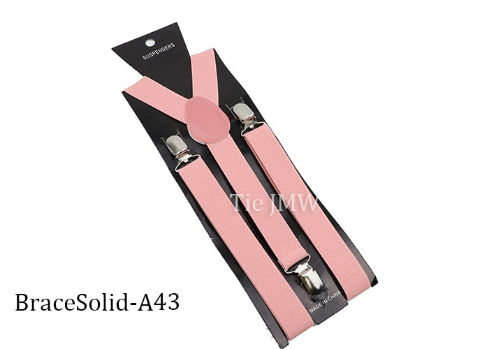 Leather Suspenders With Elastic Adjustable Straps. Comes in a variety of solid Colors.