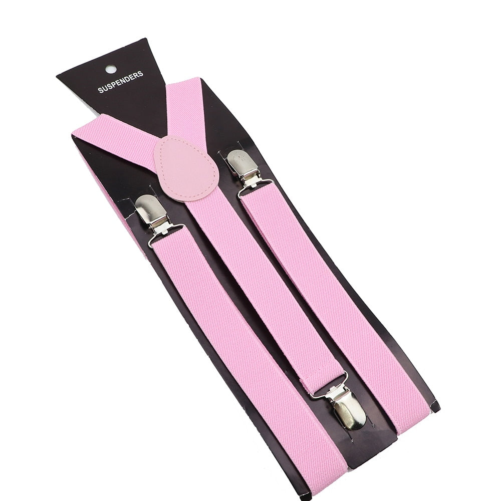 Leather Suspenders With Elastic Adjustable Straps. Comes in a variety of solid Colors.