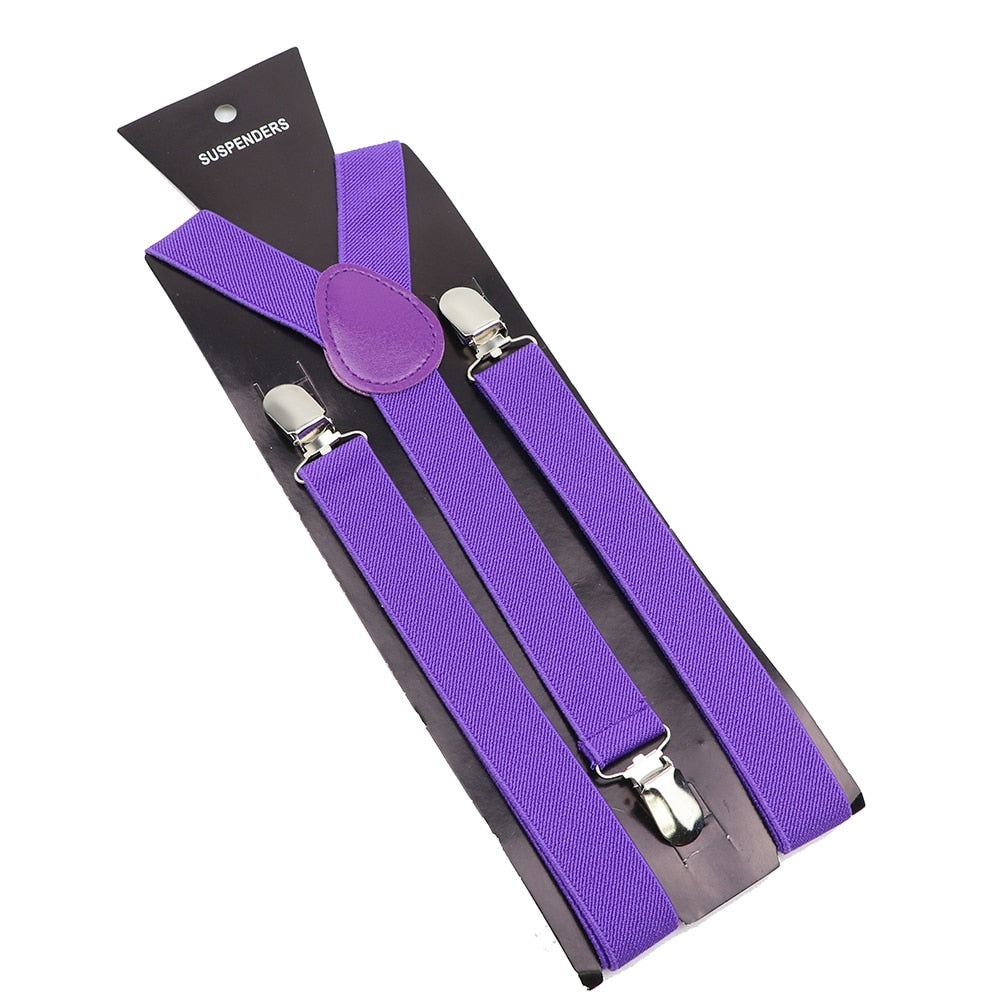 Leather Suspenders With Elastic Adjustable Straps. Comes in a variety of solid Colors.