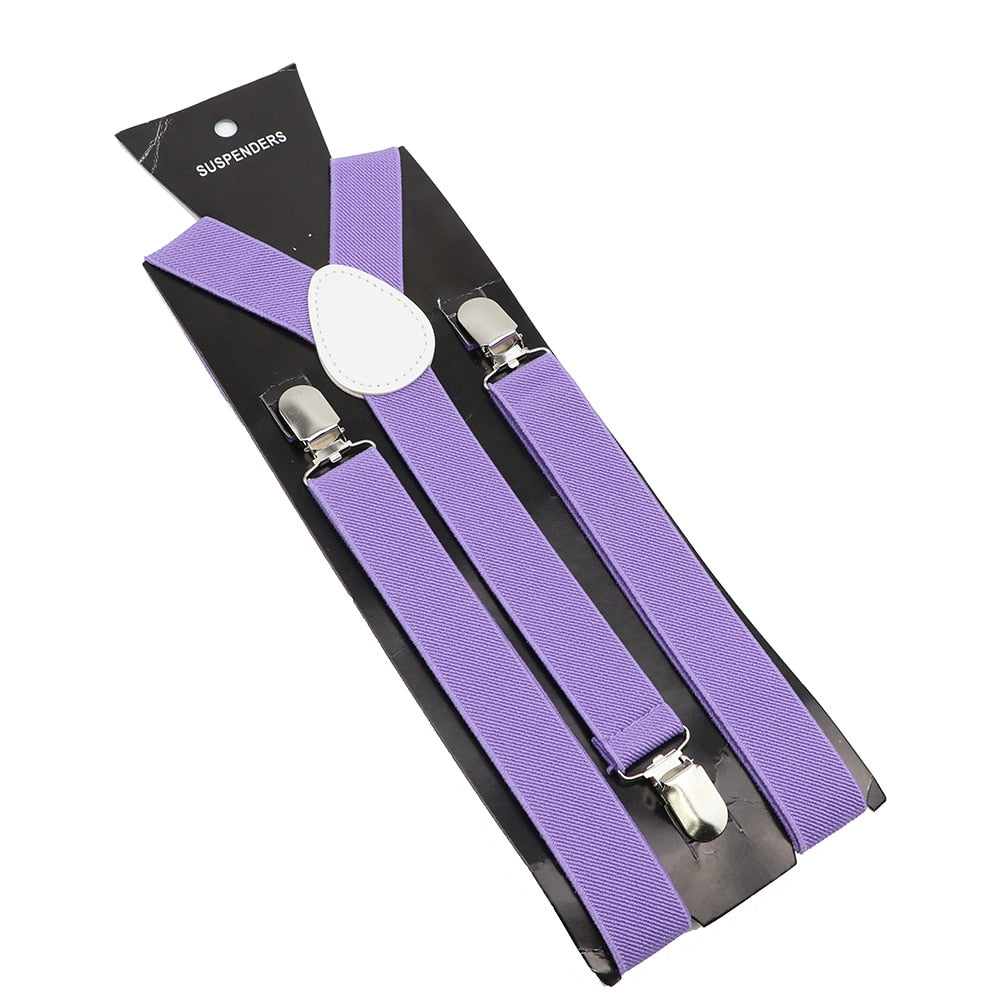 Leather Suspenders With Elastic Adjustable Straps. Comes in a variety of solid Colors.