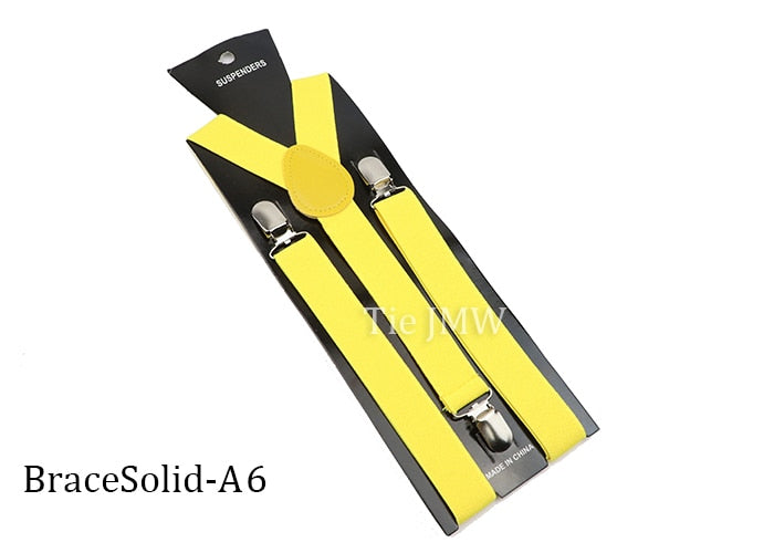 Leather Suspenders With Elastic Adjustable Straps. Comes in a variety of solid Colors.