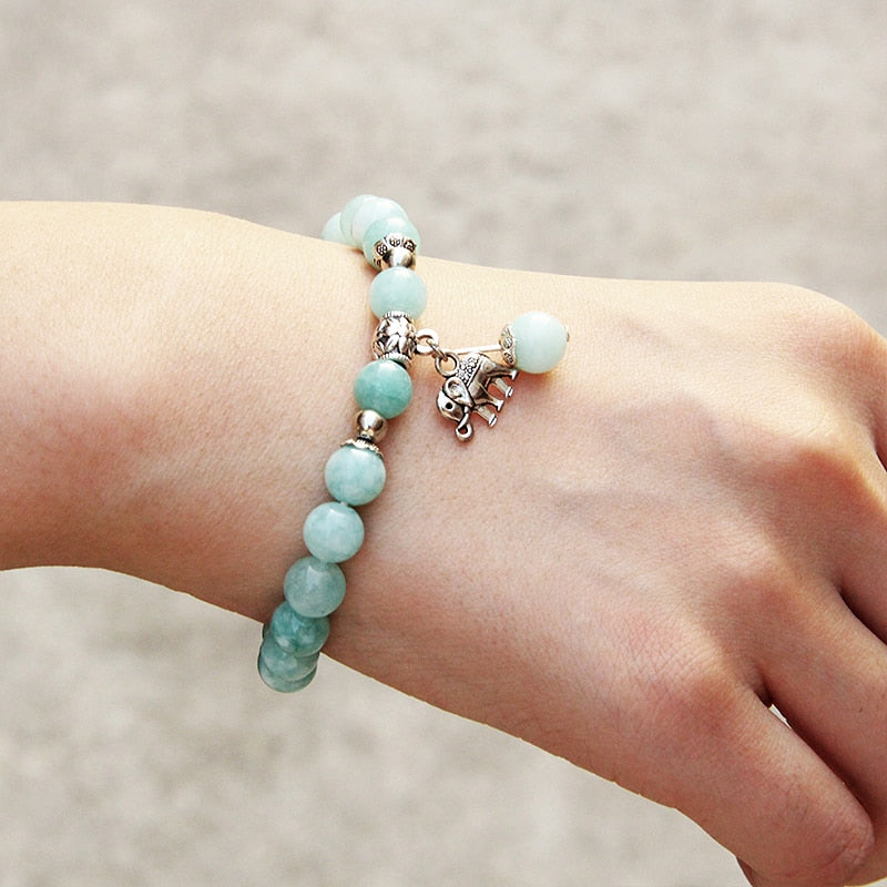 Ladies blue amazonite beaded bracelet with a metal elephant charm.