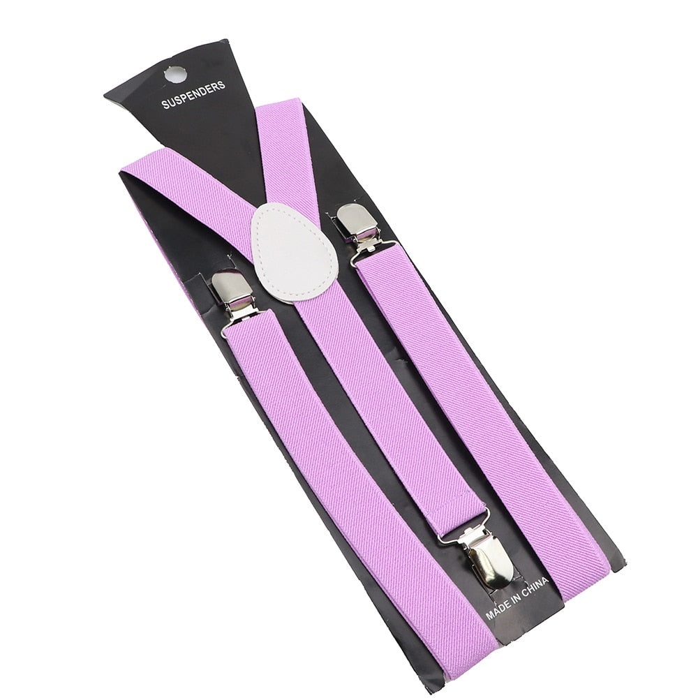 Leather Suspenders With Elastic Adjustable Straps. Comes in a variety of solid Colors.