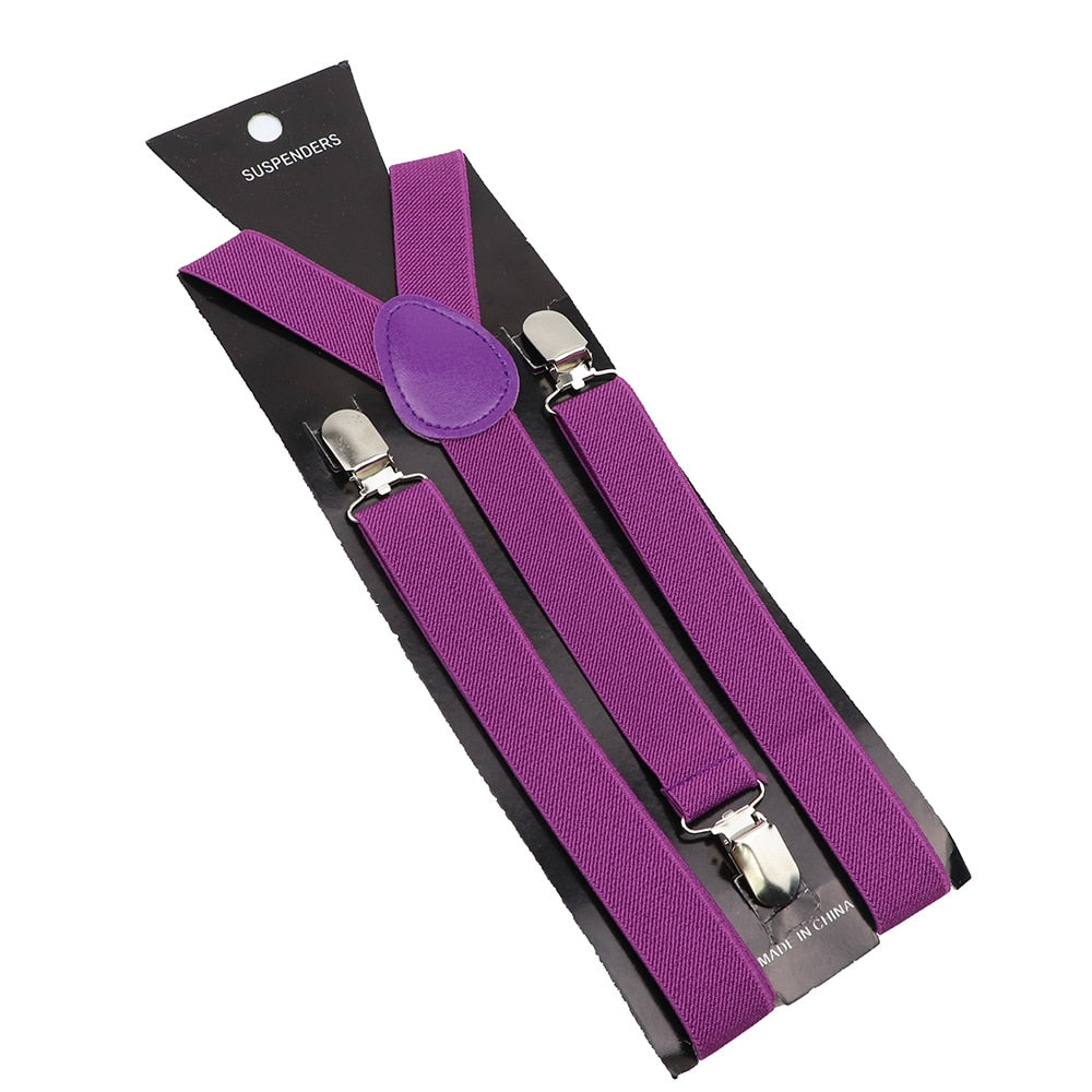 Leather Suspenders With Elastic Adjustable Straps. Comes in a variety of solid Colors.