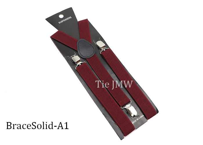 Leather Suspenders With Elastic Adjustable Straps. Comes in a variety of solid Colors.