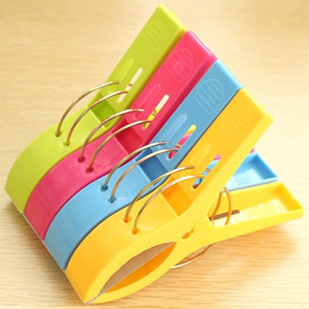 4Pcs Plastic Beach Towel Clips Or Laundry Pegs.