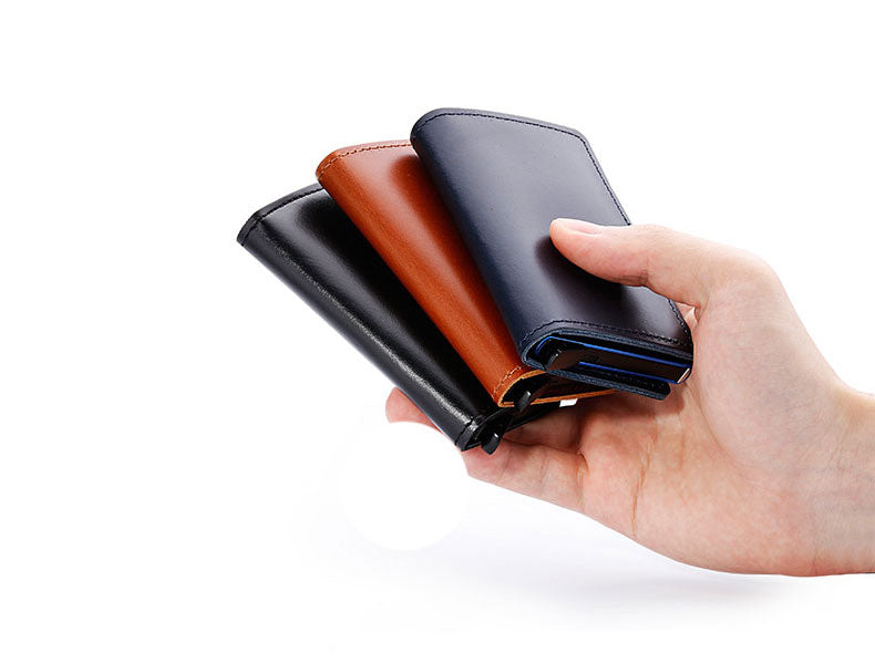 100% Genuine Leather Card Holder. RFID Protected 100% Genuine Leather. Metal side for credit cards to slide in.