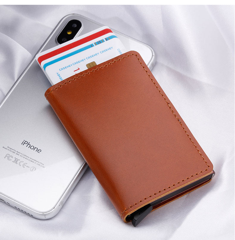 100% Genuine Leather Card Holder. RFID Protected 100% Genuine Leather. Metal side for credit cards to slide in.