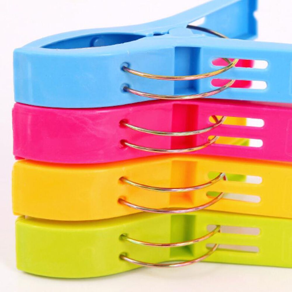 4Pcs Plastic Beach Towel Clips Or Laundry Pegs.