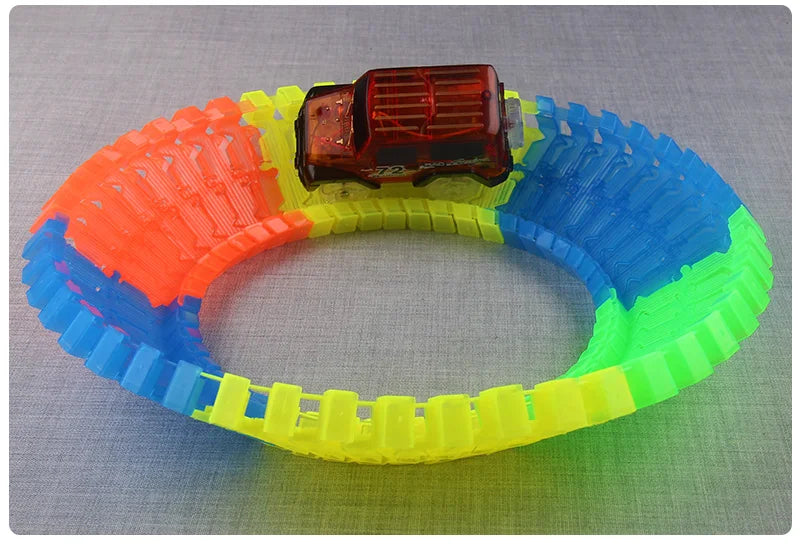 Flexible Glowing Race Track Set. Amount Of Pieces And Number Of Cars Vary.