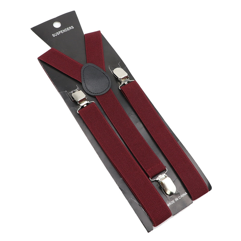 Leather Suspenders With Elastic Adjustable Straps. Comes in a variety of solid Colors.