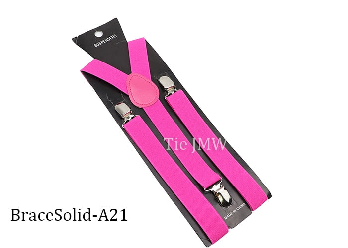 Leather Suspenders With Elastic Adjustable Straps. Comes in a variety of solid Colors.