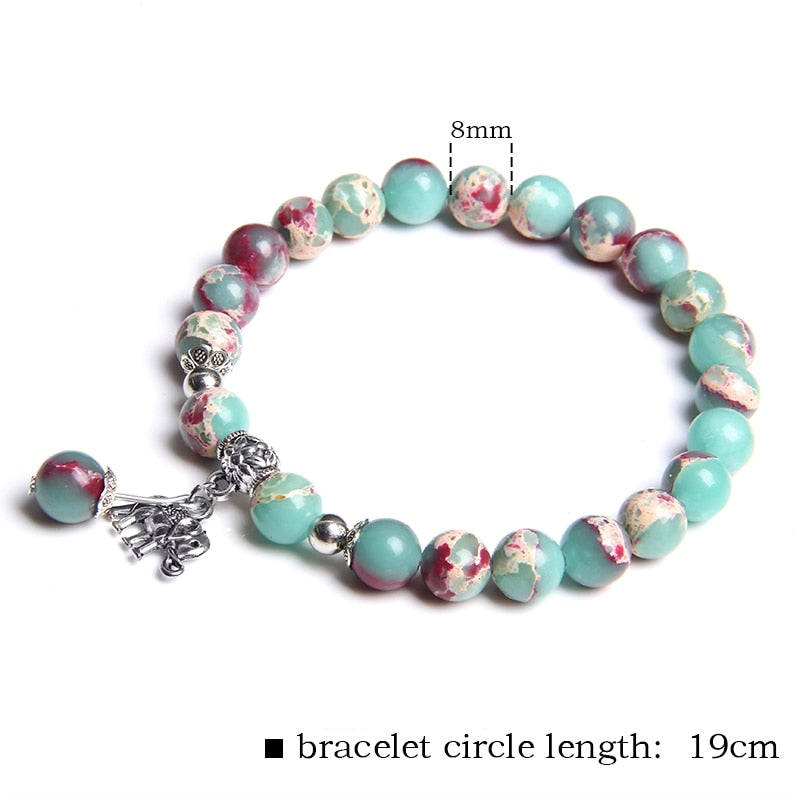 Ladies blue amazonite beaded bracelet with a metal elephant charm.