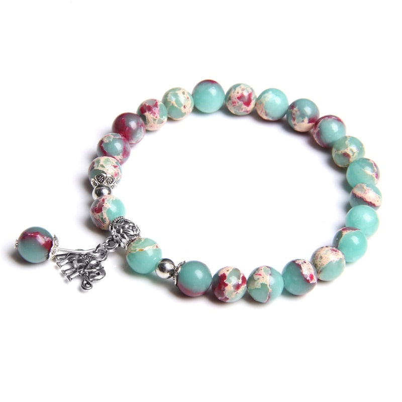 Ladies blue amazonite beaded bracelet with a metal elephant charm.