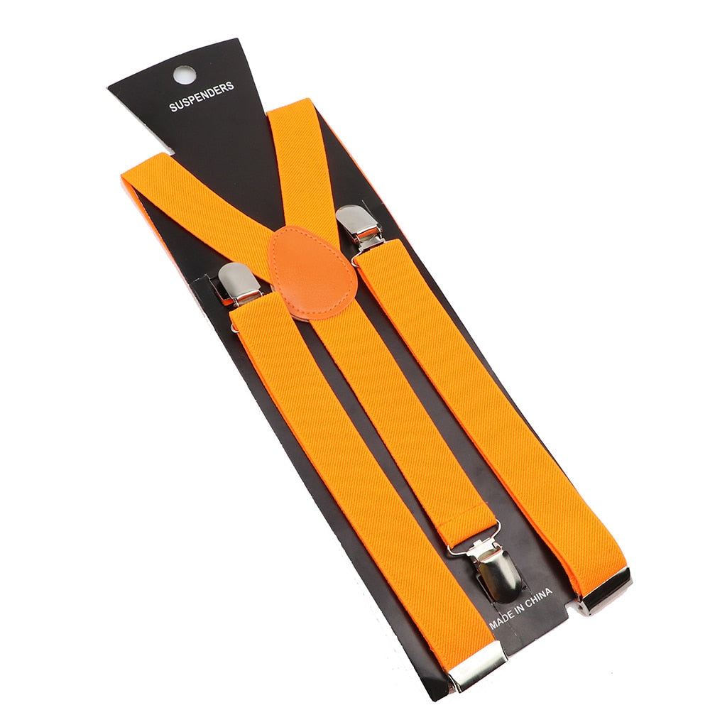 Leather Suspenders With Elastic Adjustable Straps. Comes in a variety of solid Colors.