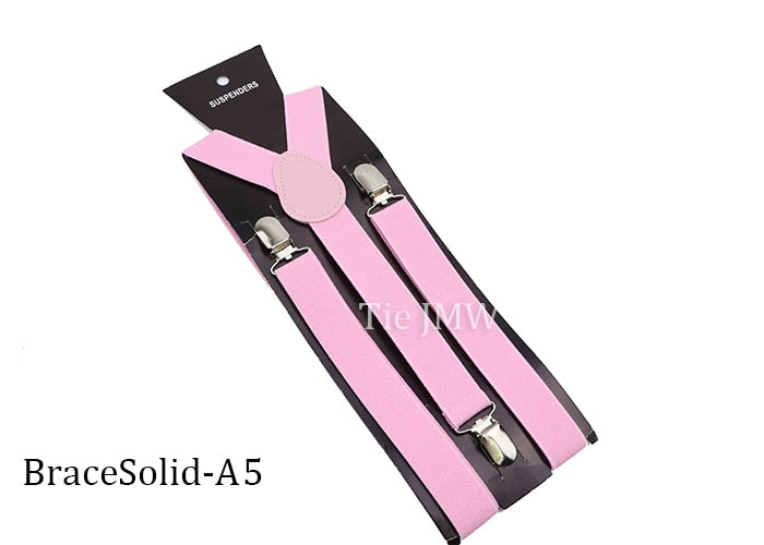 Leather Suspenders With Elastic Adjustable Straps. Comes in a variety of solid Colors.