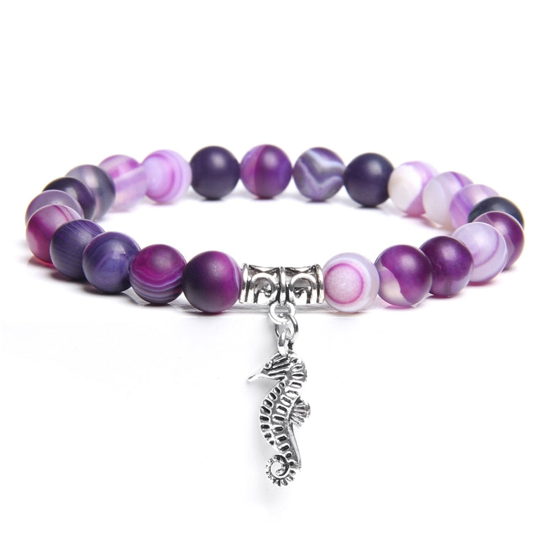 Ladies blue amazonite beaded bracelet with a metal elephant charm.