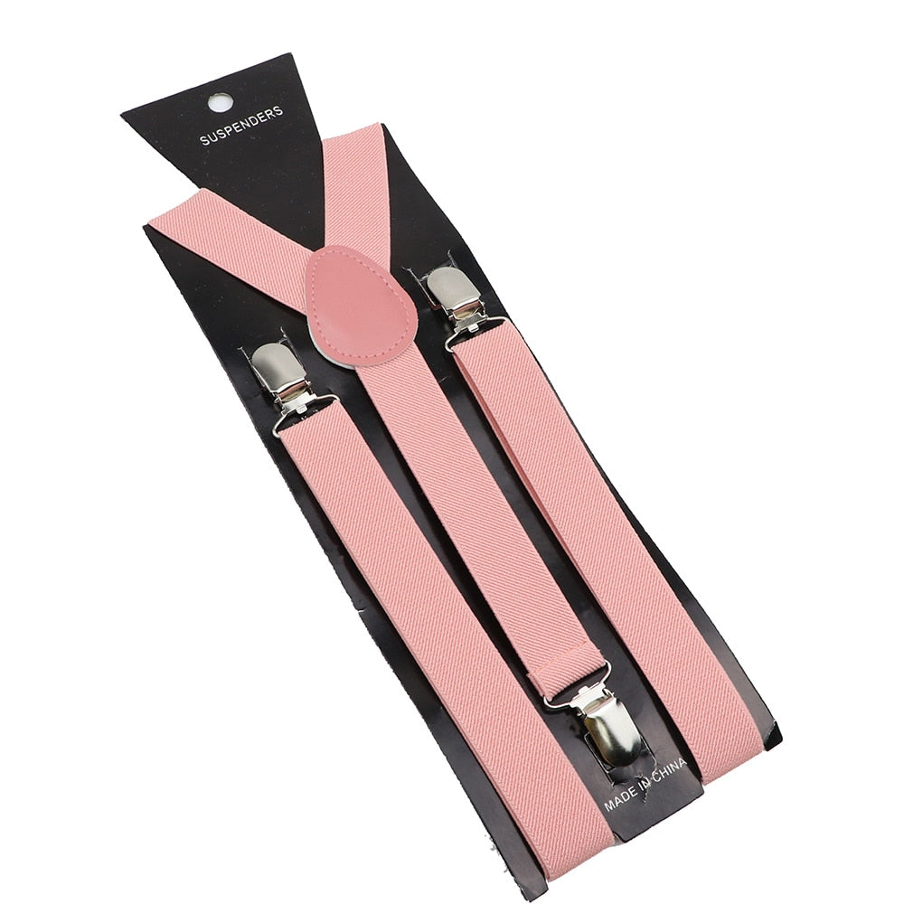 Leather Suspenders With Elastic Adjustable Straps. Comes in a variety of solid Colors.