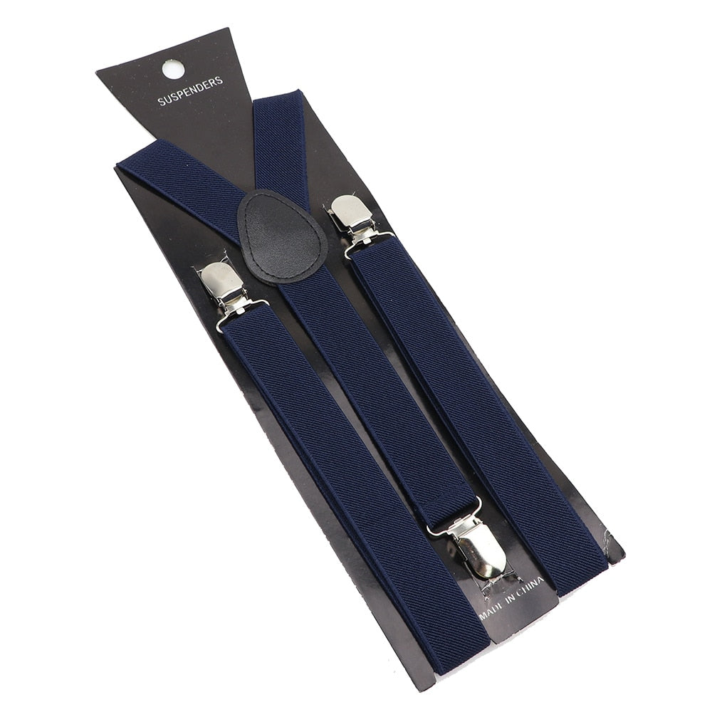 Leather Suspenders With Elastic Adjustable Straps. Comes in a variety of solid Colors.