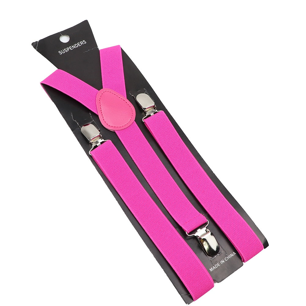 Leather Suspenders With Elastic Adjustable Straps. Comes in a variety of solid Colors.