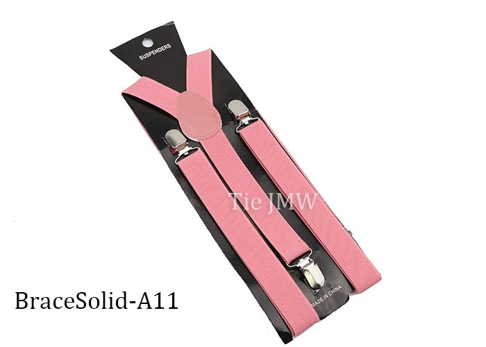 Leather Suspenders With Elastic Adjustable Straps. Comes in a variety of solid Colors.