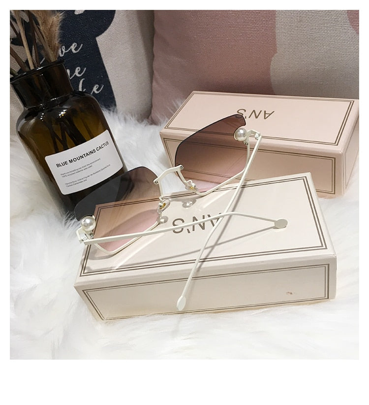 Ladies Rimless Sunglasses UV400 pearl.