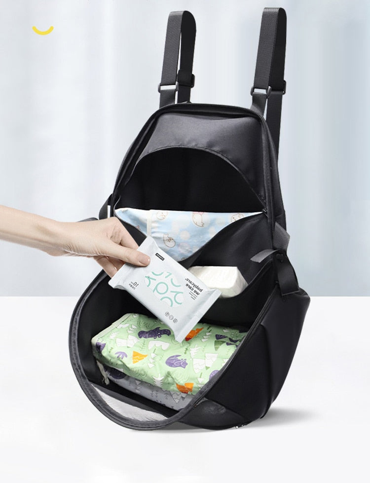 Stroller organizer bag for diapers, baby bottles and toys.