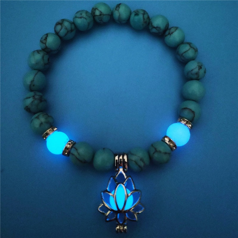 Women's glow in the dark black Lava Bracelet and flower.