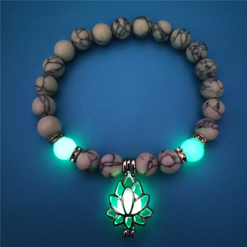 Women's glow in the dark black Lava Bracelet and flower.