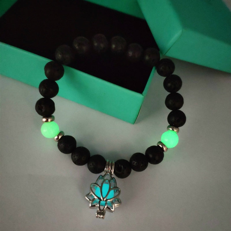 Women's glow in the dark black Lava Bracelet and flower.