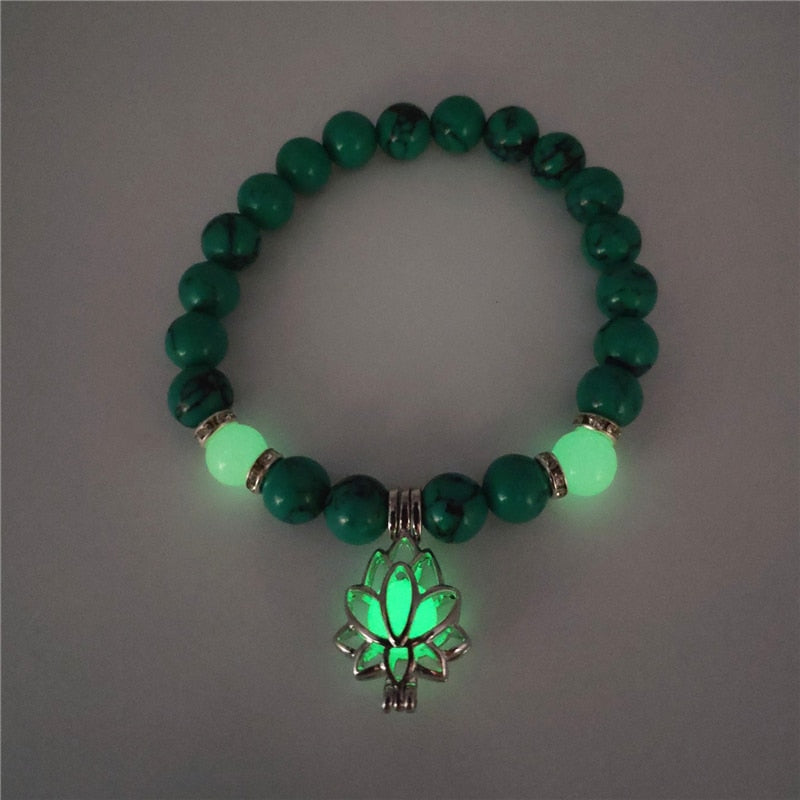 Women's glow in the dark black Lava Bracelet and flower.