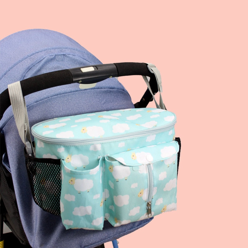 Stroller organizer bag for diapers, baby bottles and toys.