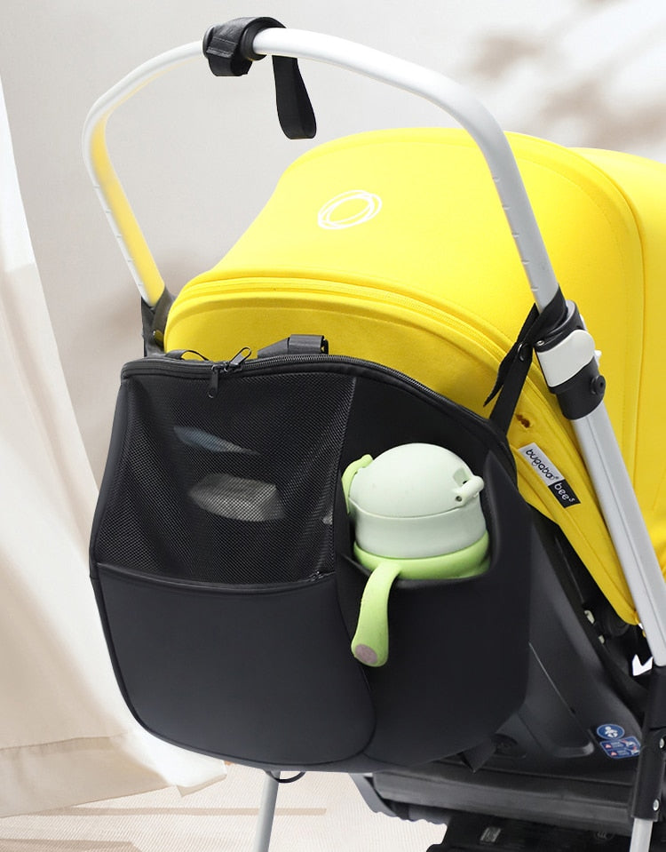 Stroller organizer bag for diapers, baby bottles and toys.