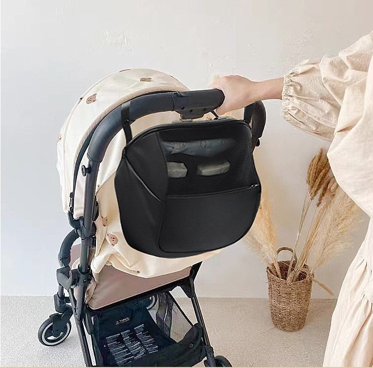 Stroller organizer bag for diapers, baby bottles and toys.