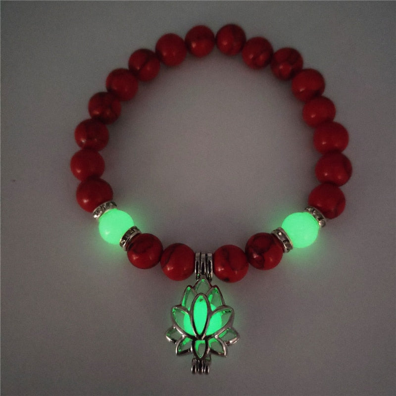 Women's glow in the dark black Lava Bracelet and flower.