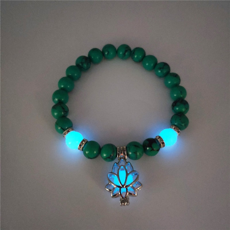 Women's glow in the dark black Lava Bracelet and flower.