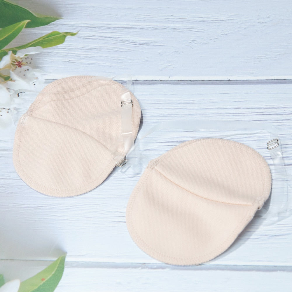 Perspiration Pads that attach over your shoulder. Absorbing, Washable Shields to protect your best dress.