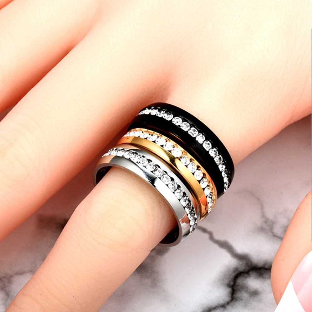 Woman's Exquisite Stainless Steel wedding Ring. Comes in Black, Gold or Silver.
