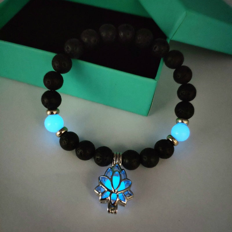 Women's glow in the dark black Lava Bracelet and flower.