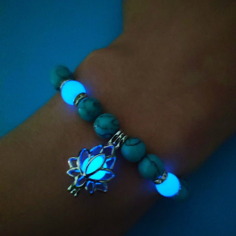 Women's glow in the dark black Lava Bracelet and flower.